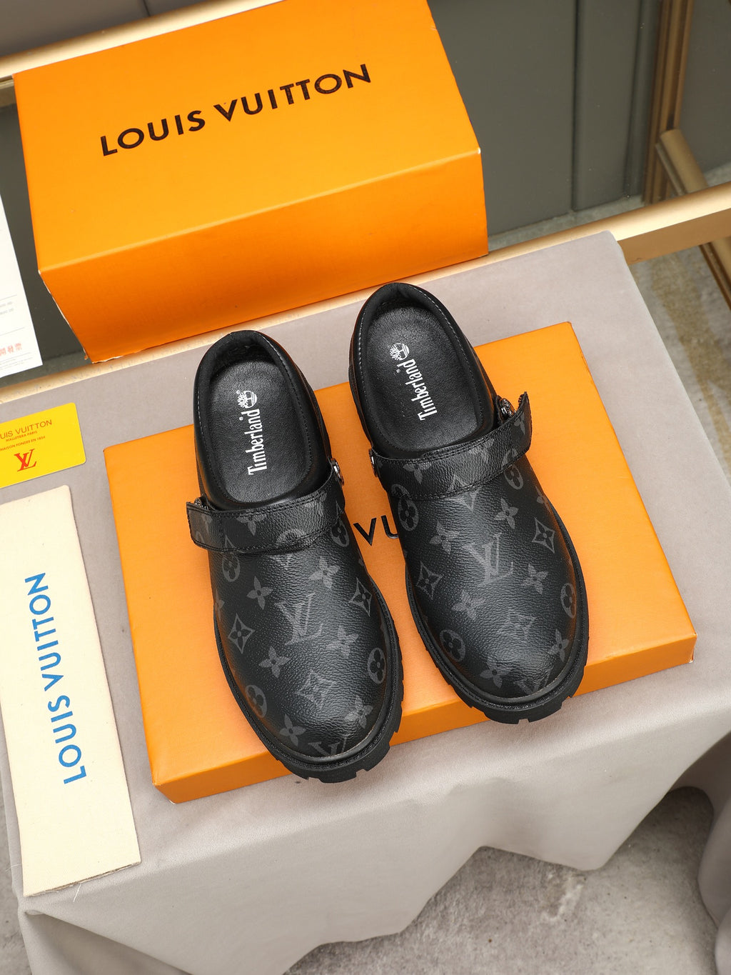 VV Retro-style monogram ankle boots (collaboration model)  2026070202