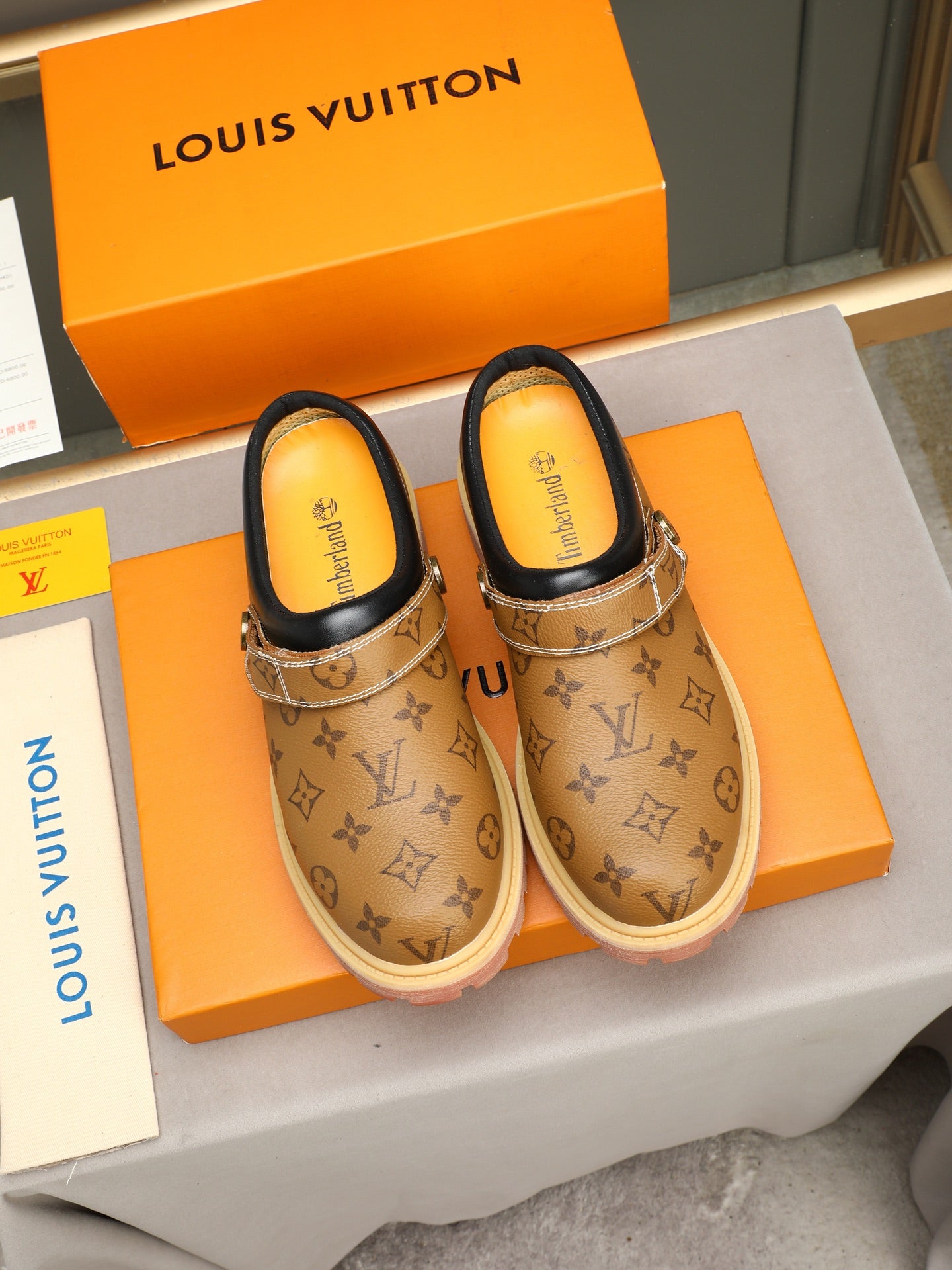 VV Retro-style monogram ankle boots (collaboration model)  2026070202