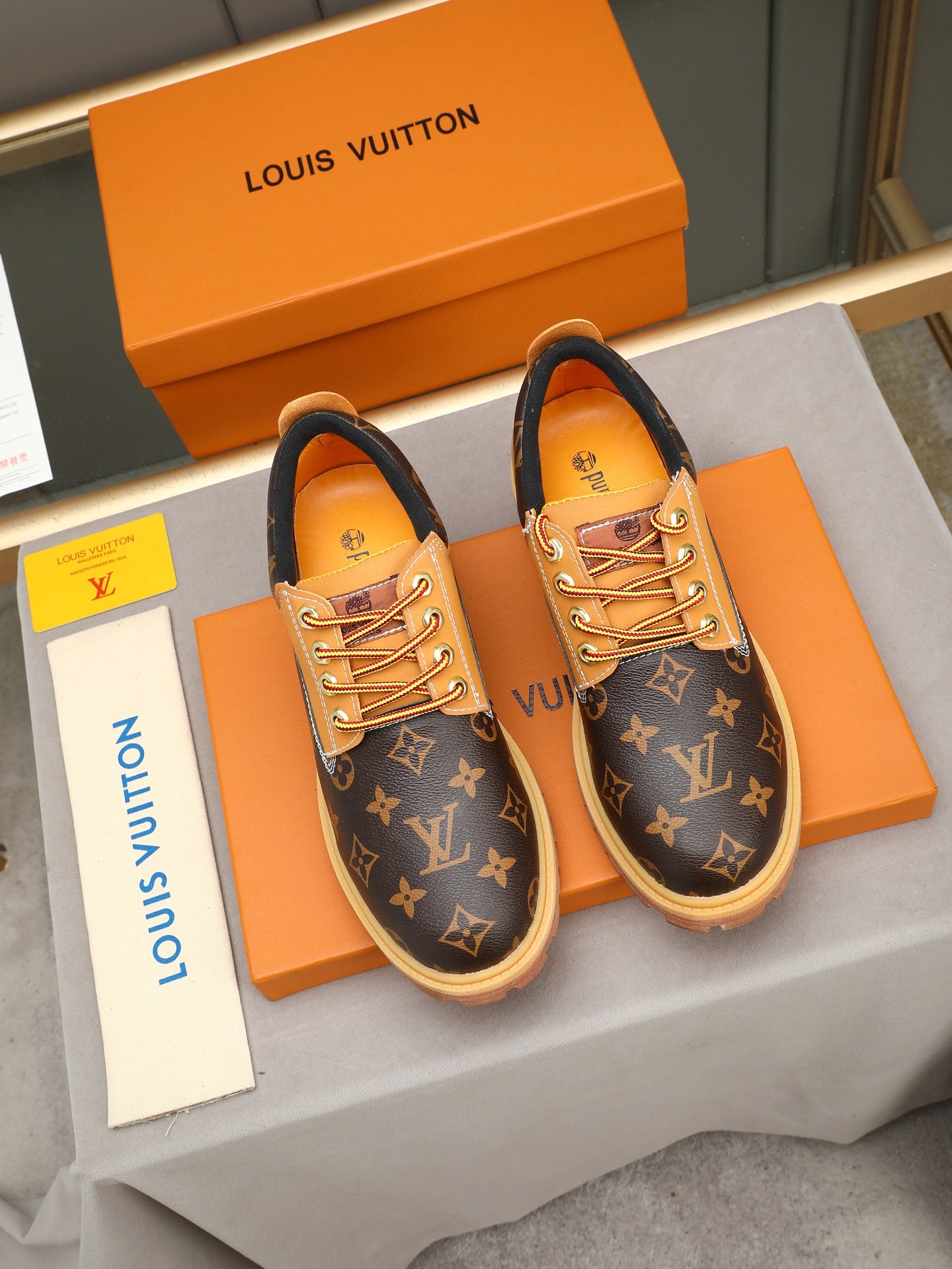 VV Retro-style monogram ankle boots (collaboration model)  2026070301
