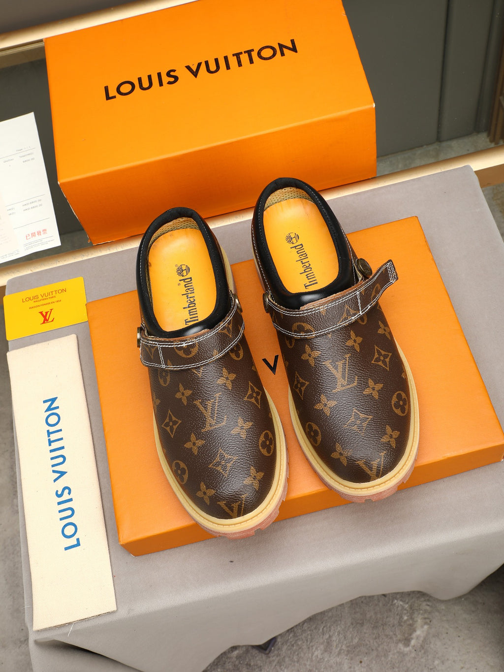 VV Retro-style monogram ankle boots (collaboration model)  2026070202