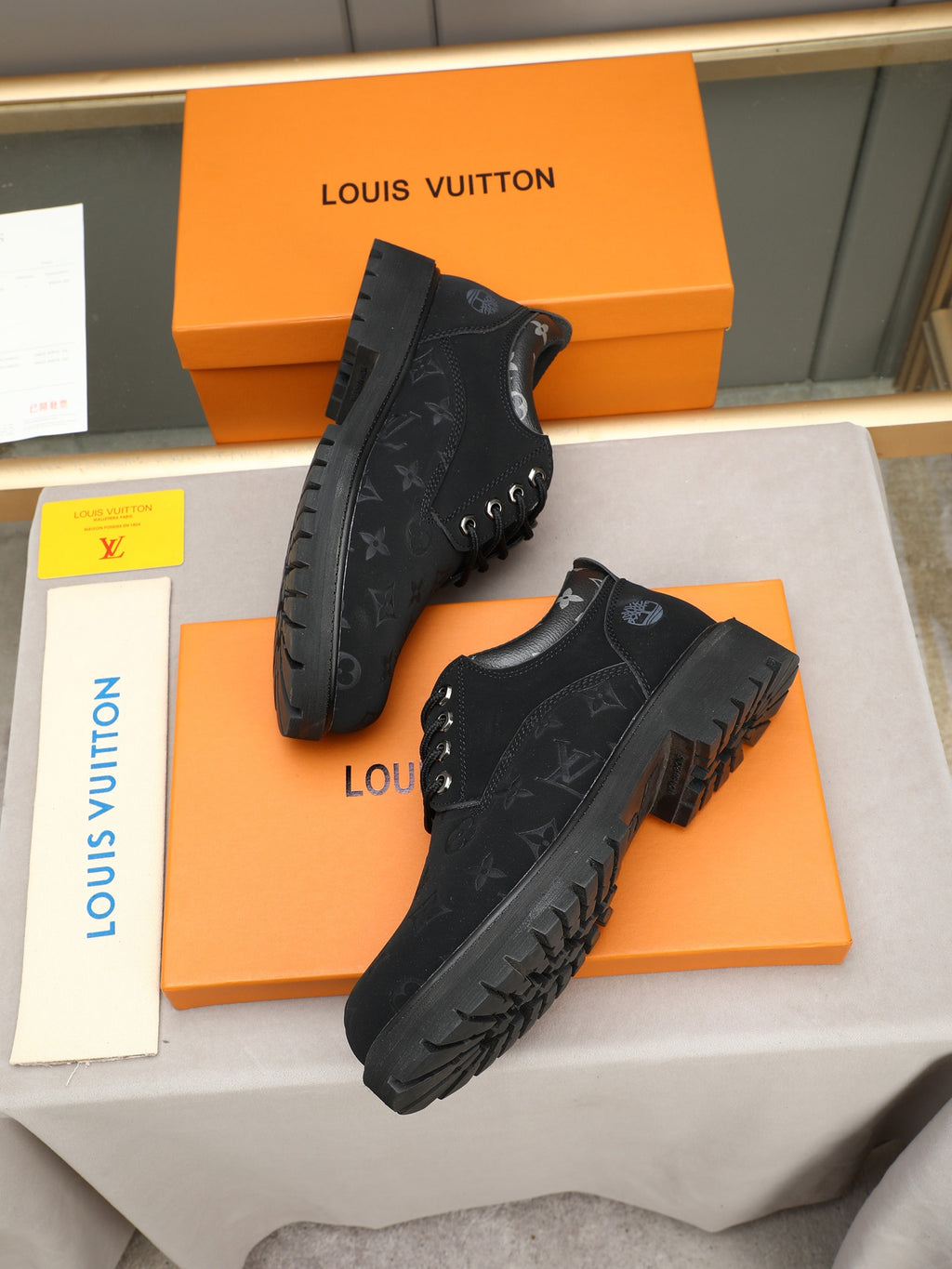 VV Retro-style monogram ankle boots (collaboration model)  2026070301