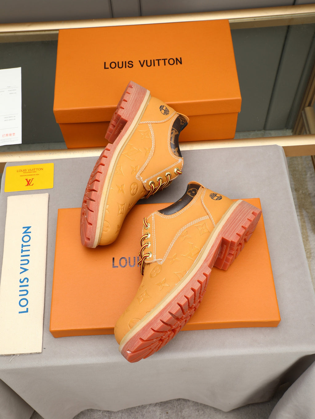 VV Retro-style monogram ankle boots (collaboration model)  2026070301