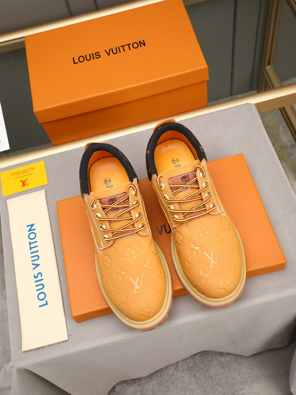 VV Retro-style monogram ankle boots (collaboration model)  2026070301