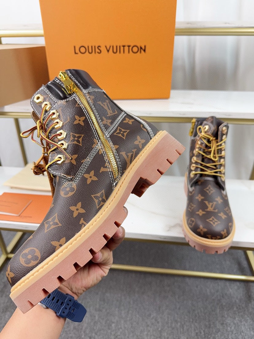 VV  Collaboration monogram embossed ankle boots  25121707