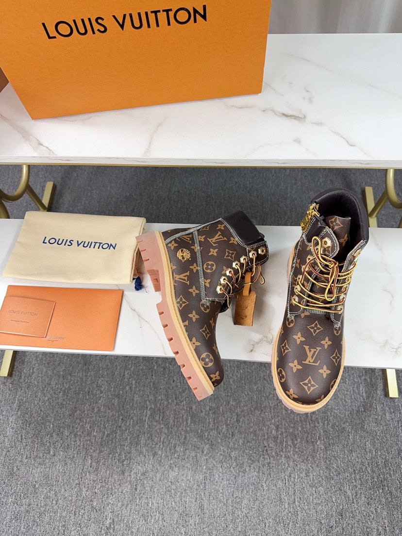 VV  Collaboration monogram embossed ankle boots  25121707