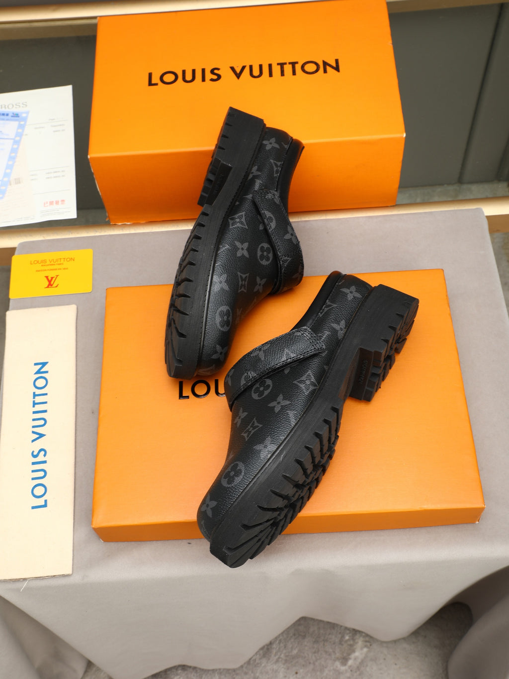 VV Retro-style monogram ankle boots (collaboration model)  2026070202