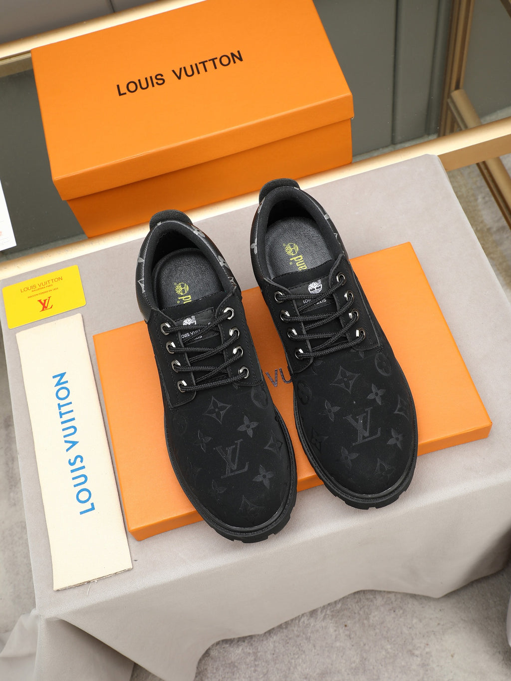 VV Retro-style monogram ankle boots (collaboration model)  2026070301