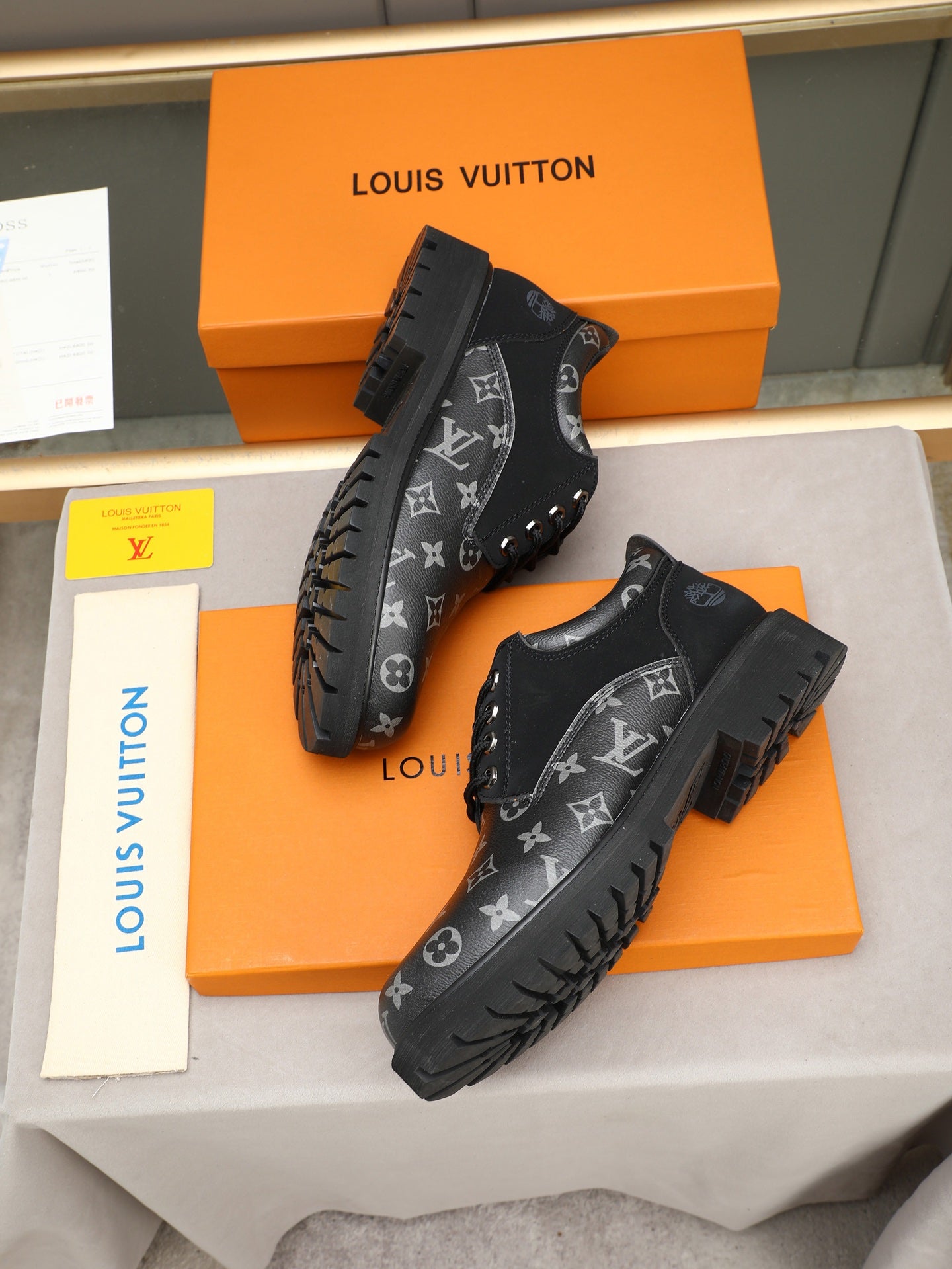 VV Retro-style monogram ankle boots (collaboration model)  2026070301