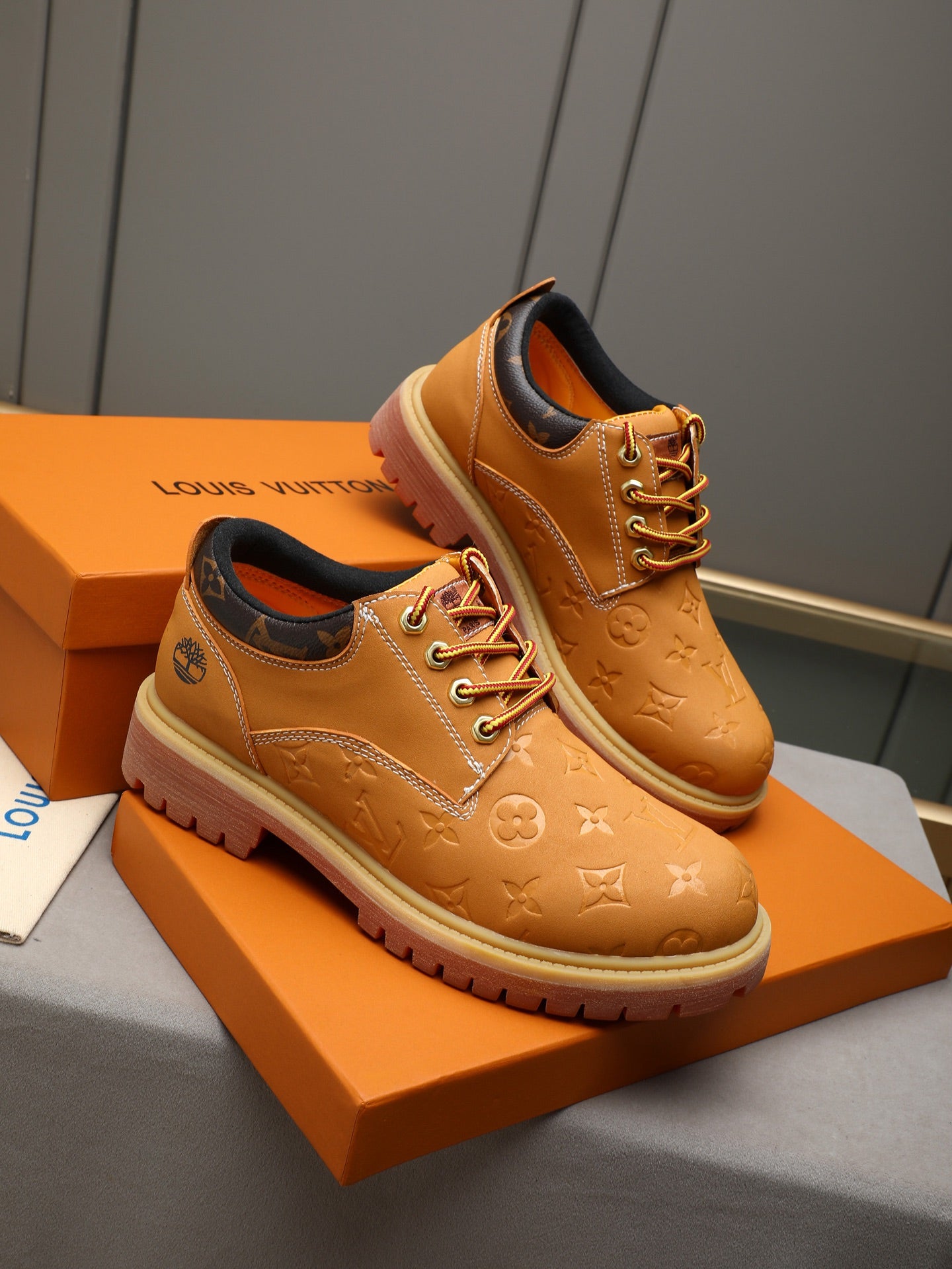 VV Retro-style monogram ankle boots (collaboration model)  2026070301