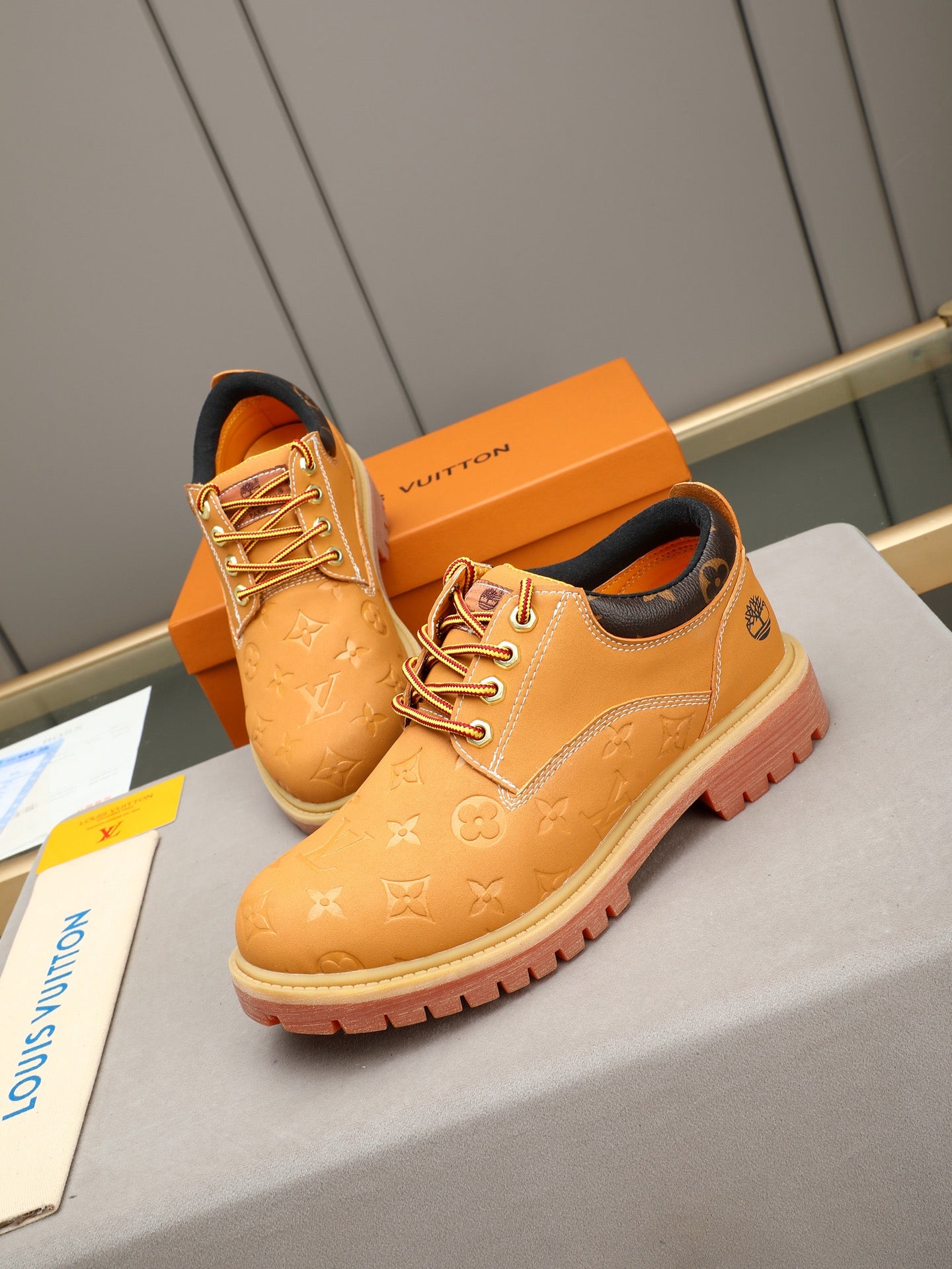 VV Retro-style monogram ankle boots (collaboration model)  2026070301
